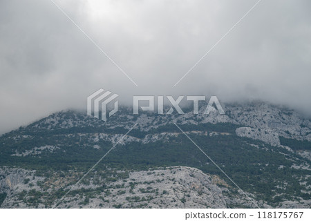 View of the Biokovo mountain range of the Dinaric Alps from Makarska riviera, Adriatic coast of Croatia 118175767