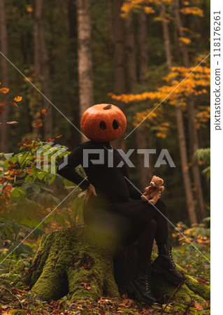 Surreal Pumpkin Head in Autumn Forest Surreal Pumpkin Head in Autumn Forest 118176261