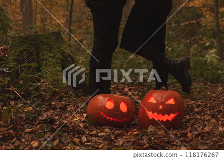 Glowing Halloween Pumpkins in Autumn Forest 118176267