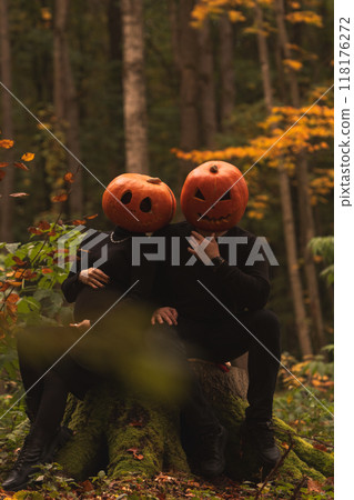 Halloween Pumpkin Heads in Autumn Forest Halloween Pumpkin Heads in Autumn Forest 118176272