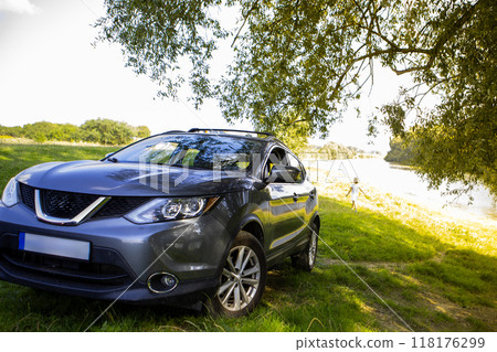 Gray SUV by the River in Nature Gray SUV by the River in Nature 118176299