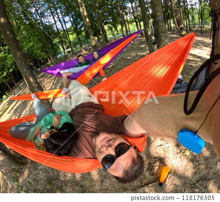 Relaxing in Colorful Hammocks in the Forest 118176305