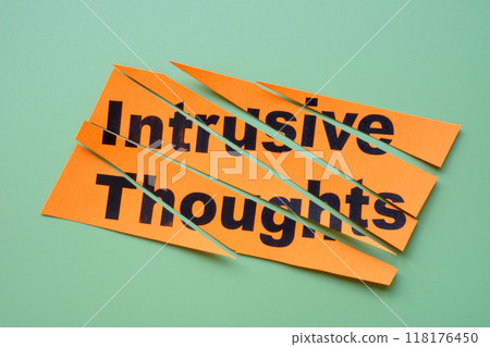 Cut paper with the label intrusive thoughts. Cut paper with the label intrusive thoughts. 118176450