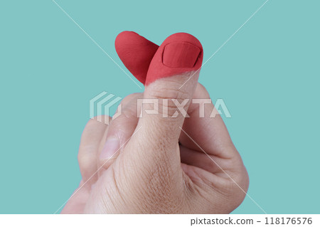 closeup of a man doing the finger heart gesture closeup of a man doing the finger heart gesture 118176576