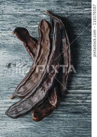high angle view of some ripe carob pods 118176587