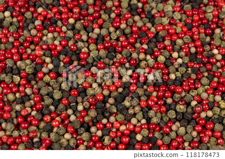 A mixture of different peppercorns white, black, red and green peppers spices. 118178473