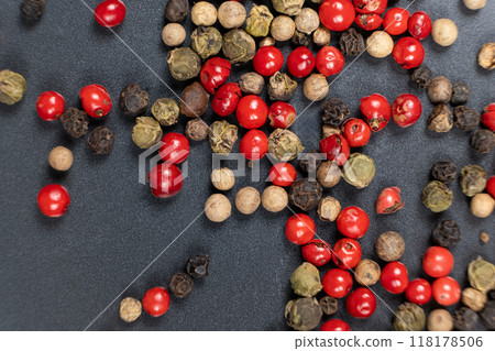 A mixture of different peppercorns white, black, red and green peppers spices. A mixture of different peppercorns white, black, red and green peppers spices. 118178506