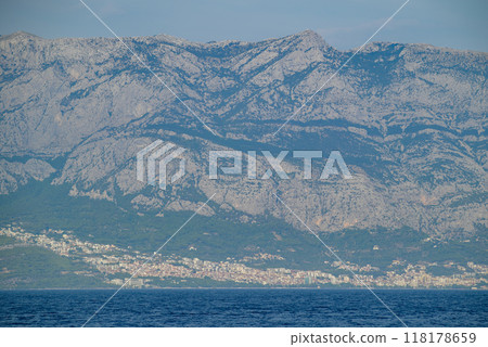 View of the Biokovo mountain range of the Dinaric Alps from Makarska riviera, Adriatic coast of Croatia View of the Biokovo mountain range of the Dinaric Alps from Makarska riviera, Adriatic coast of Croatia 118178659