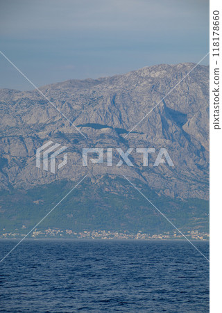 View of the Biokovo mountain range of the Dinaric Alps from Makarska riviera, Adriatic coast of Croatia 118178660