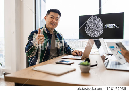 IT expert working on artificial intelligence developments in office 118179086