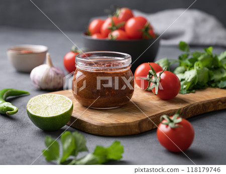 Tomato paste of hot pepper marinara with garlic, tomatoes and herbs in jars  118179746