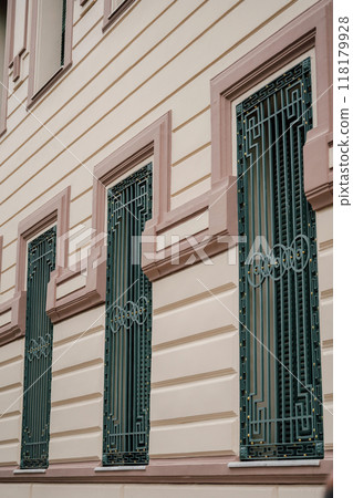 metal bars on the windows of the building on the top floor metal bars on the windows of the building on the top floor 118179928