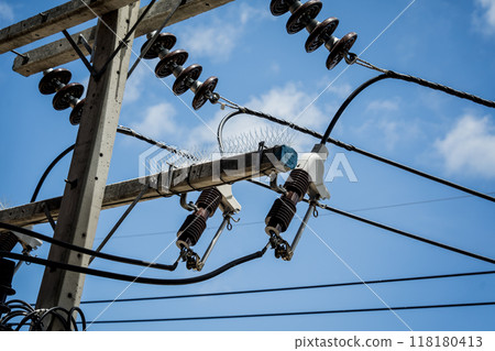 Various electrical equipment is set against a bright blue sky Various electrical equipment is set against a bright blue sky 118180413
