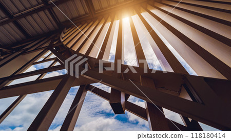 A structure featuring wooden slats on construction site contributing to its architectural style 118180414