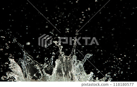 Crown water to object make curve drop explosion in ripple motion. Black background isolated. Crown Water splash on object to create shape form fluttering in droplet and wave. Crown water to object make curve drop explosion in ripple motion. Black background isolated. Crown Water splash on object to create shape form fluttering in droplet and wave. 118180577