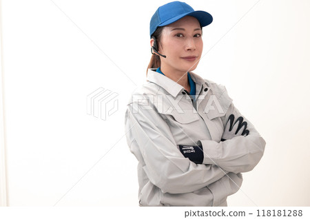 Female truck driver with arms folded Female truck driver with arms folded 118181288