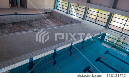 Empty Pool Renovation in a Public Pool. Sports Season Preparation Concept Empty Pool Renovation in a Public Pool. Sports Season Preparation Concept 118181732