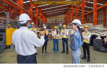 Warehouse safety meeting, people with hard hats. Industrial teamwork. Warehouse safety meeting, people with hard hats. Industrial teamwork. 118182521