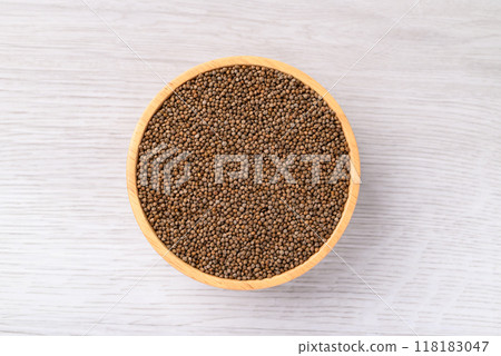 Perill seeds in wooden bowl on white table, Food ingredient, Top view 118183047