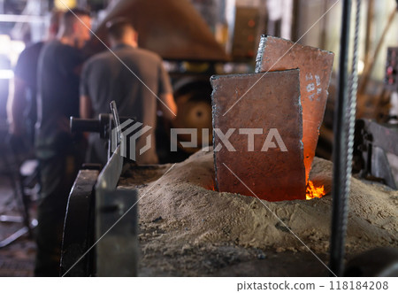 Foundry - ferrous metal is melted in an induction furnace of metallurgical plant Foundry - ferrous metal is melted in an induction furnace of metallurgical plant 118184208