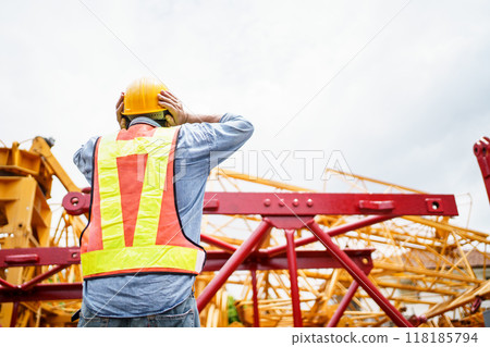 Engineer is looking at the collapse construction. Engineer is looking at the collapse construction. 118185794