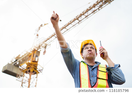 Careless worker at construction site without wearing helmet. Careless worker at construction site without wearing helmet. 118185796