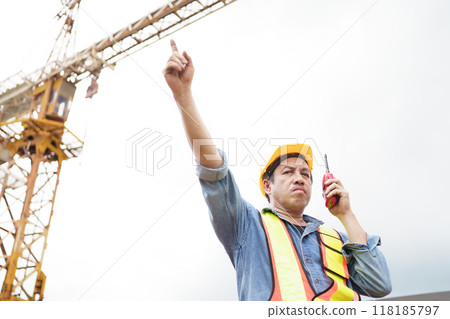 Careless worker at construction site without wearing helmet. Careless worker at construction site without wearing helmet. 118185797