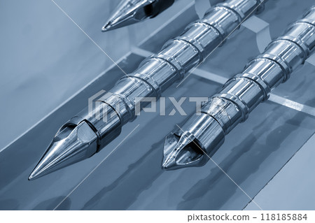 Close up scene the head of barrel screw of injection machine spare parts in the light blue scene. Close up scene the head of barrel screw of injection machine spare parts in the light blue scene. 118185884