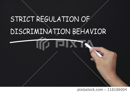 Strict regulation of discrimination behavior text written on blackboard. Safe workplace concept 118186004