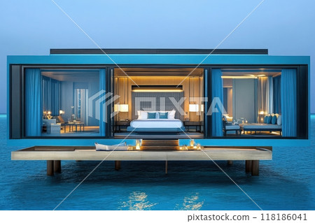 Experience the magic of a secluded overwater villa in the Maldives, where golden lights glow softly within elegant interiors as the sun sets over the tranquil ocean waters. 118186041