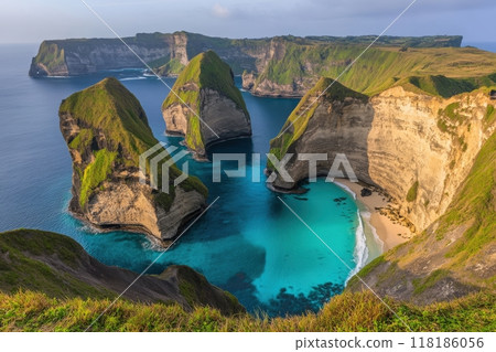 Marvel at the breathtaking view of majestic cliffs meeting the crystal-clear waters of Bali, perfect for a romantic getaway. Enjoy the calm, vibrant hues of the sea and lush greenery. 118186056
