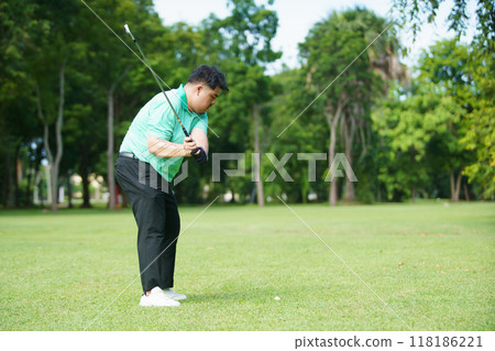 Man is playing golf in morning. 118186221