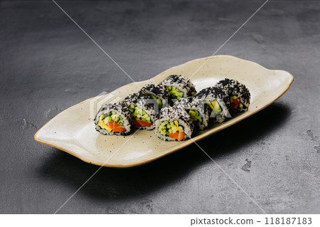 Sushi rolls with black caviar and fresh vegetables, ideal for Japanese cuisine and food photography Sushi rolls with black caviar and fresh vegetables, ideal for Japanese cuisine and food photography 118187183