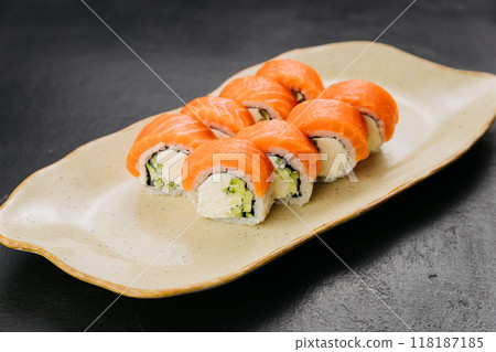 Philadelphia salmon sushi rolls with creamy filling, perfect for Japanese cuisine lovers  118187185