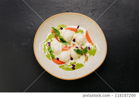 Elegant gourmet dish with cheese balls, herbs, and grapefruit, dining and culinary presentations 118187200