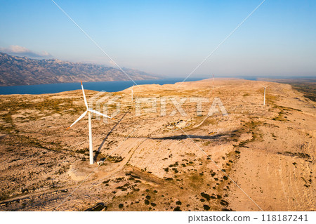 Wind turbines produce sustainable electric power on Pag Island. Innovative solution to obtain sustainable source of electricity without harm in Croatia 118187241