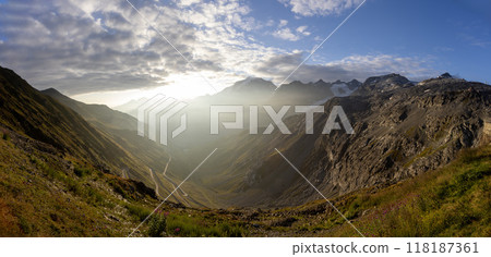 Impressive sunrise at italian Dolomiites. Wonderful Picturesque landscape with colorful dramatic sky over the mountain valley. Impressive sunrise at italian Dolomiites. Wonderful Picturesque landscape with colorful dramatic sky over the mountain valley. 118187361