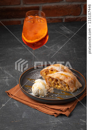 Portion of German strudel with ice cream 118187446
