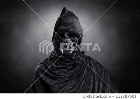 Grim reaper over dark misty background 118187501