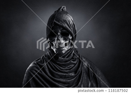Grim reaper over dark misty background 118187502