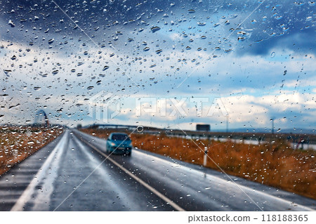 Car and road in stormy day.Safety drive concept. 118188365