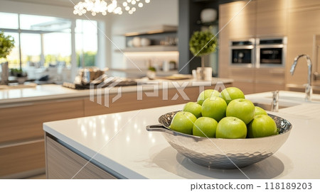 Modern open kitchen space, predominantly white with warm maple tones, organized and elegant, essential kitchen tools, a decorative bowl of green apples, even lighting without shadows, no people, ideal Modern open kitchen space, predominantly white with warm maple tones, organized and elegant, essential kitchen tools, a decorative bowl of green apples, even lighting without shadows, no people, ideal 118189203