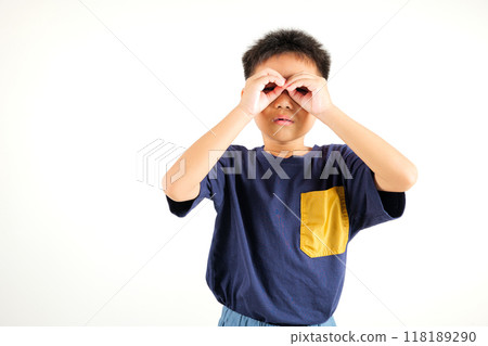 Searching concept. Asian young boy kid looking far away with hand over head at studio shot isolated on white background, Portrait of Happy primary child looking at distance with eyes shaded Searching concept. Asian young boy kid looking far away with hand over head at studio shot isolated on white background, Portrait of Happy primary child looking at distance with eyes shaded 118189290