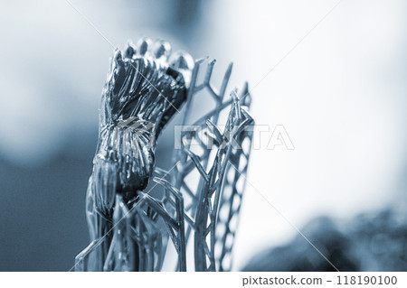 Model of leg printed on a 3D printer from black rubber, close-up. Part of an object created on a 3D printer from hardened rubber under the influence of ultraviolet light. SLA 3D printing technology. 118190100