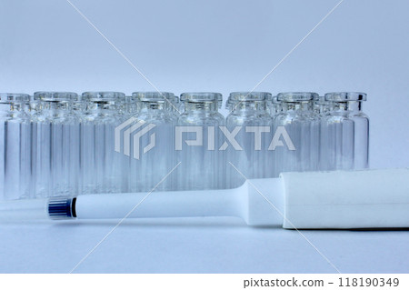 New glass vials for instrumental analysis on a white background. analytical vials prepared for chemical analysis New glass vials for instrumental analysis on a white background. analytical vials prepared for chemical analysis 118190349