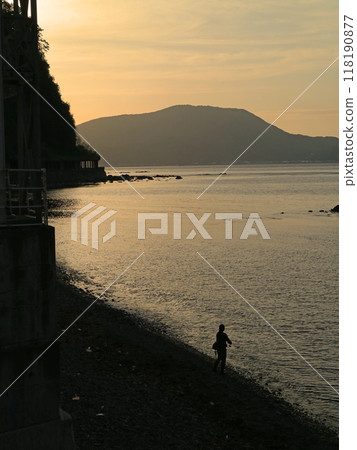 Angler on the rocky coast of Setakamui, Shakotan Peninsula, Hokkaido 118190877