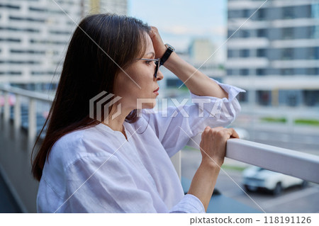 Sad upset stressed mature woman, outdoor portrait Sad upset stressed mature woman, outdoor portrait 118191126