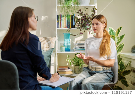 Teenage girl at therapy session with mental health professional Teenage girl at therapy session with mental health professional 118191157