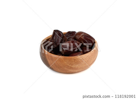 Dehydrated date fruits in wooden bowl on white background. Dehydrated date fruits in wooden bowl on white background. 118192001