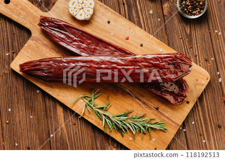 Traditional salami sticks with garlic and herbs, perfect for gourmet meals and charcuterie boards 118192513